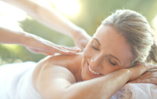 woman receiving massage at spa